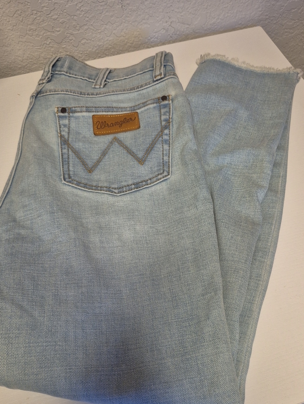 Wrangler Light Blue High-Rise Jeans with Frayed Hem